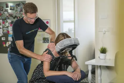A woman gets an office massage from Seated Massage